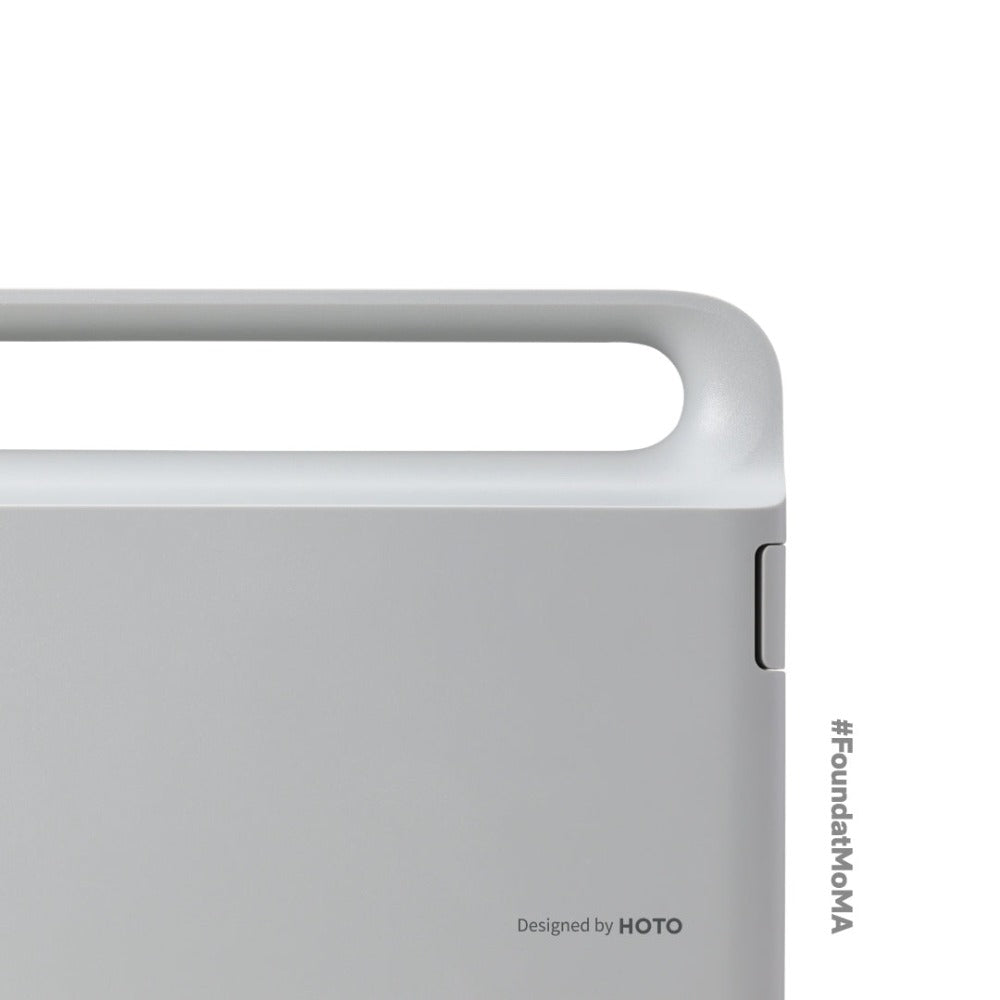 Close-up of a gray electronic device with 'HOTO' branding on a white background