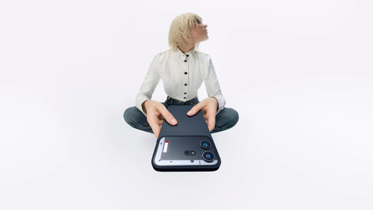 A Female holding a Nothing Phone (4b) for Review