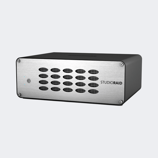 Glyph StudioRAID desktop hard drive with a silver vented front panel and black enclosure, front three-quarter view.