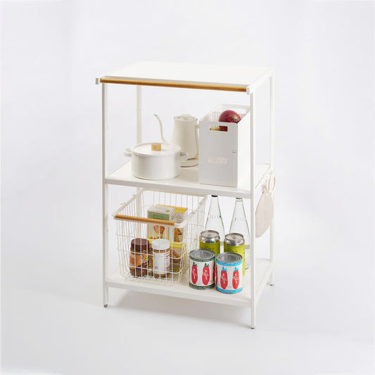 White 35-inch three-shelf storage rack holding cookware, baskets and pantry items, with its hanging bar and side hooks visible.