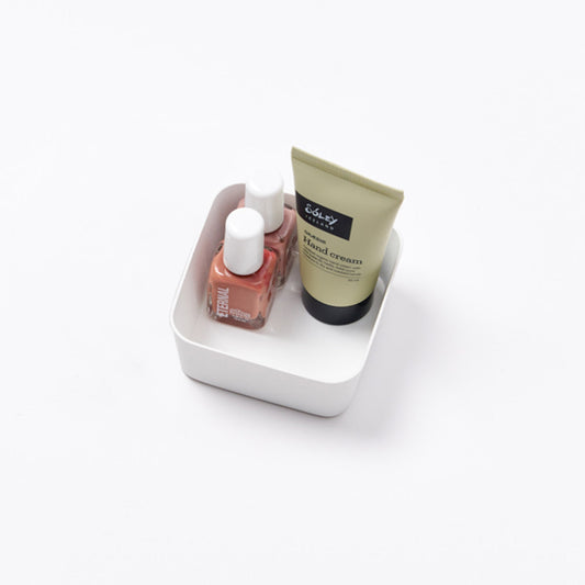 Yamazaki Tower small white flat vanity tray holding nail polish and a cosmetic tube; contents not included.