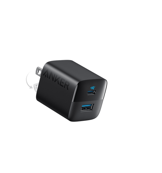 Anker 323 charger in black, angled to show USB-C and USB-A ports with a folding-plug illustration.