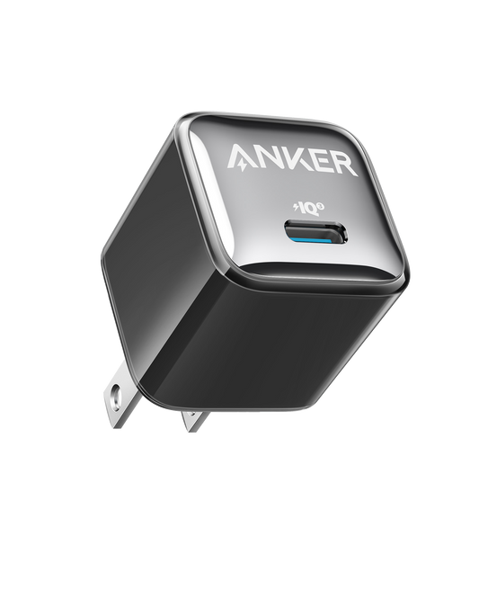 Anker Nano USB-C charger in black, angled to show its front port, logo and wall-plug prongs.