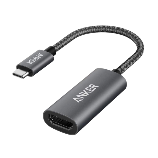 Anker USB-C to HDMI adapter with a dark aluminum housing, HDMI socket and short braided cable with a USB-C plug.