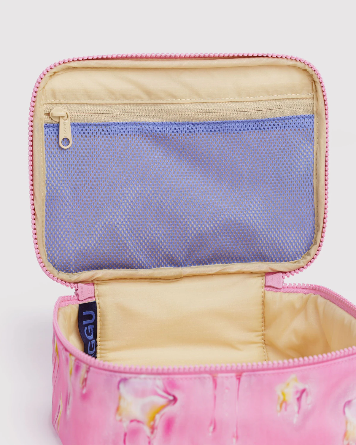 Baggu Small Cosmetic Case with floral pattern and open zipper showing purple interior. | Dancing Star