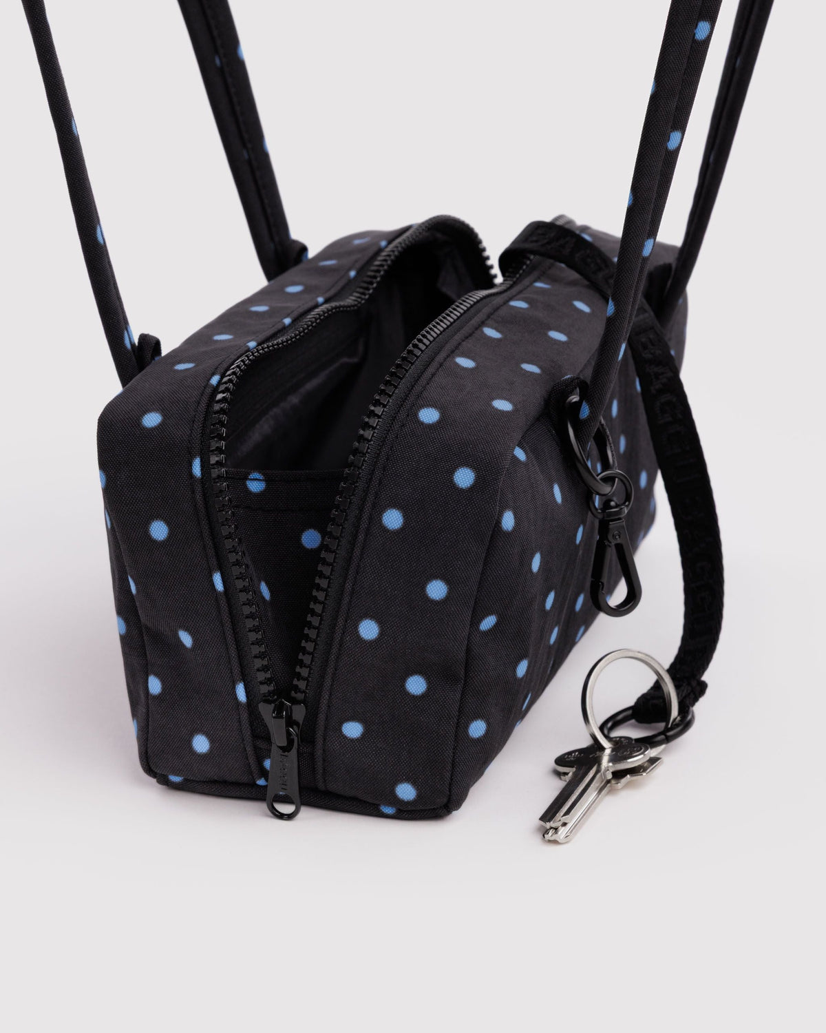 Baggu Small Nylon Bowler Bag, open zipper and interior detail with keys shown beside the bag | Black and Sky Blue Micro Dot