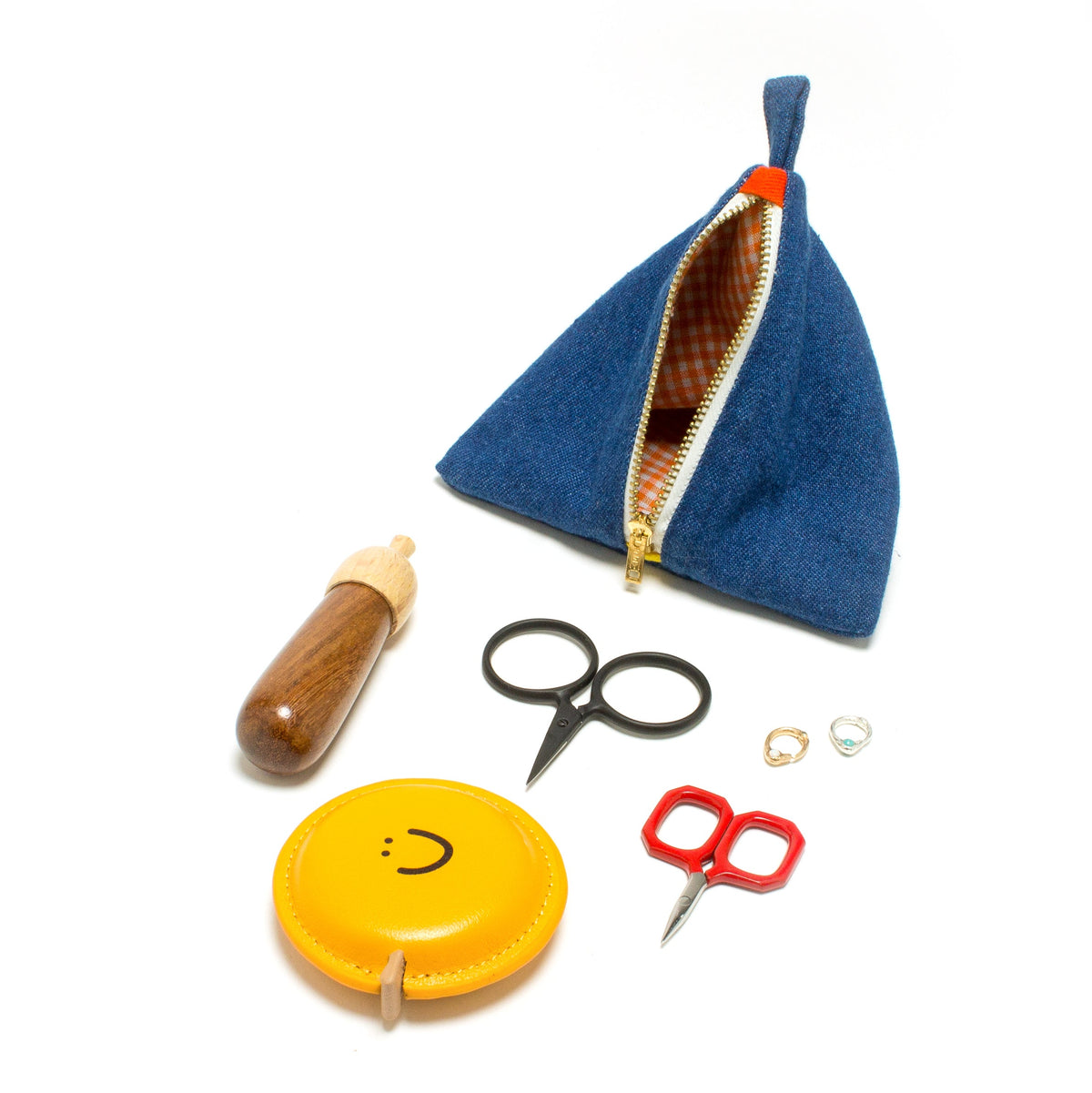 DEGEN Open blue denim pyramid pouch showing gingham lining, displayed with scissors and small craft accessories