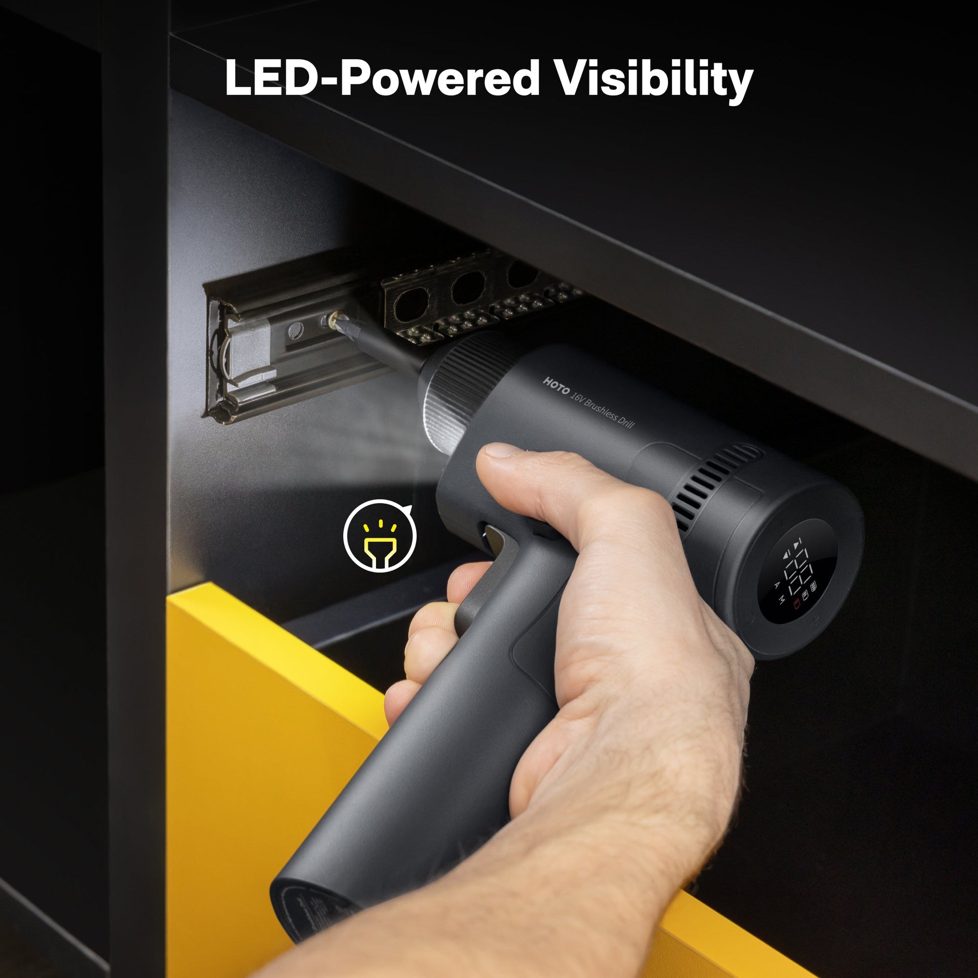 Hand using a handheld vacuum cleaner with LED-powered visibility feature.