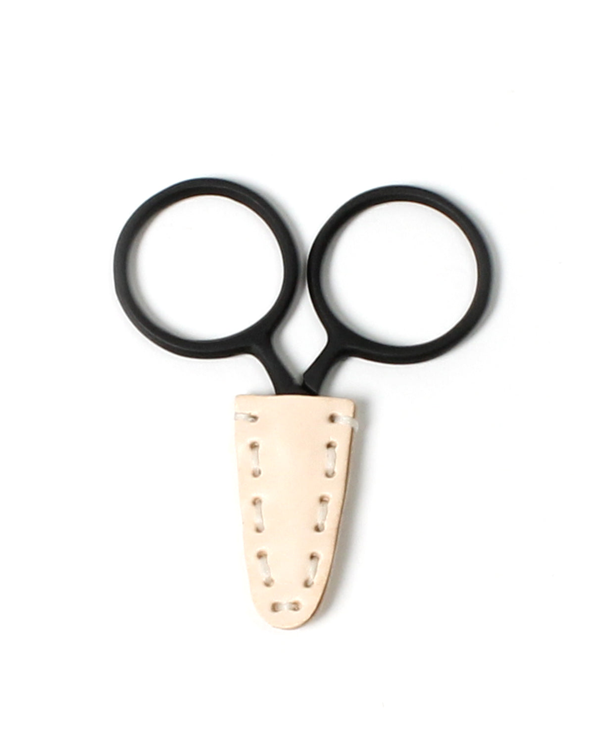 DEGEN Light natural leather scissor tip protector fitted to black round-handled scissors