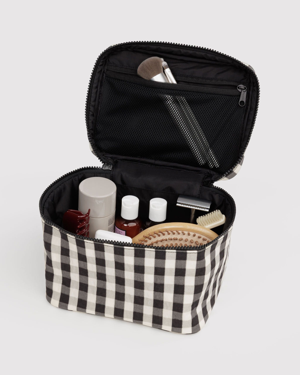 BAGGU Large Cosmetic Case in Black and Cream Gingham, open with toiletries | Black and Cream Gingham
