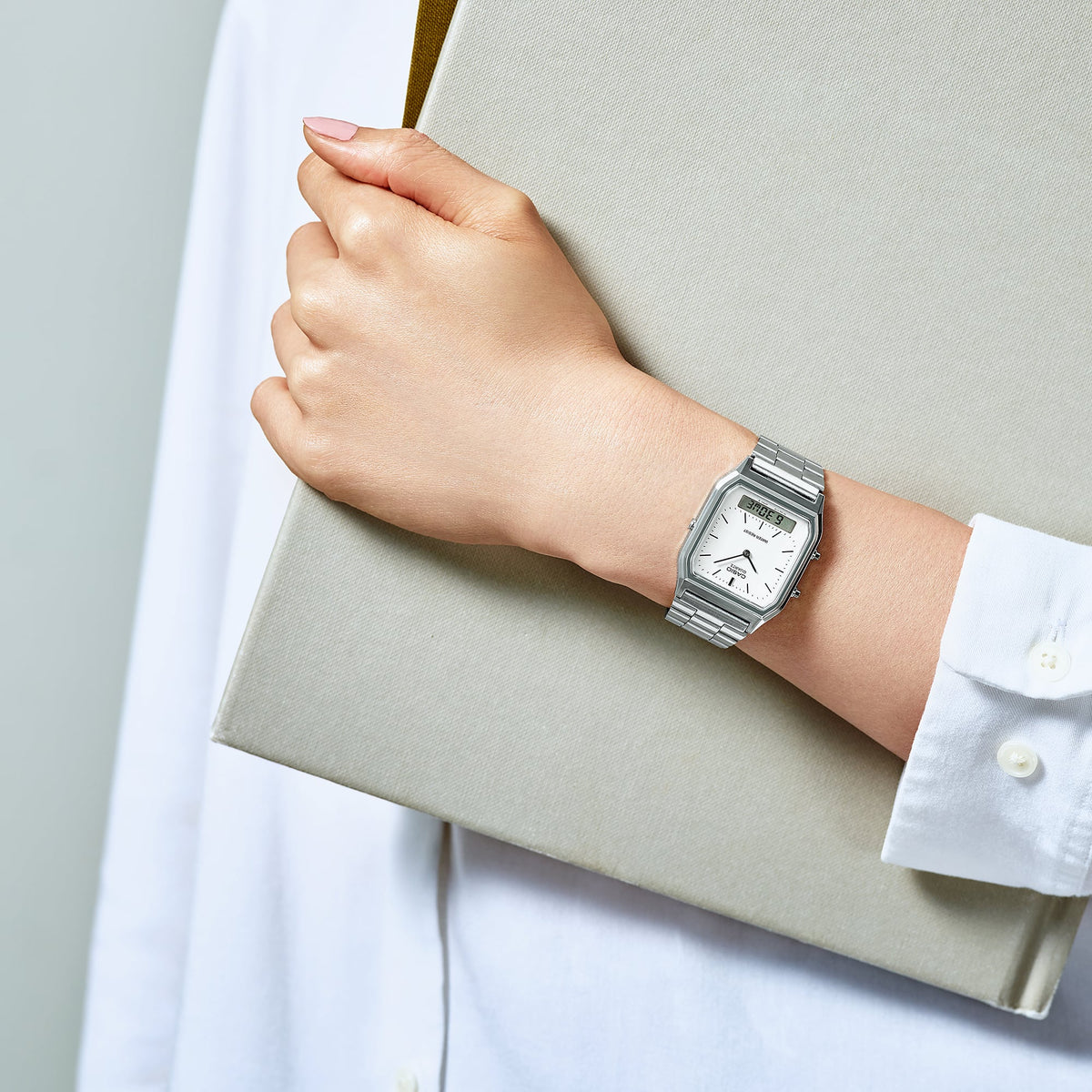 Casio AQ230A-7DM silver watch worn on the wrist
