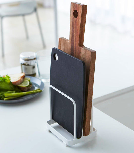 Yamazaki Home Plate Cutting Board Stand - Steel, white stand holding two cutting boards beside the sink