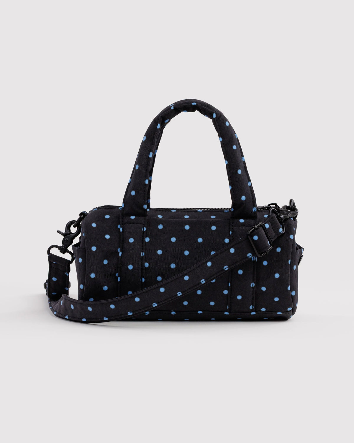 BAGGU Small Nylon Duffle Bag in Black and Sky Blue Micro Dot, front view on a light background | Black and Sky Blue Micro Dot