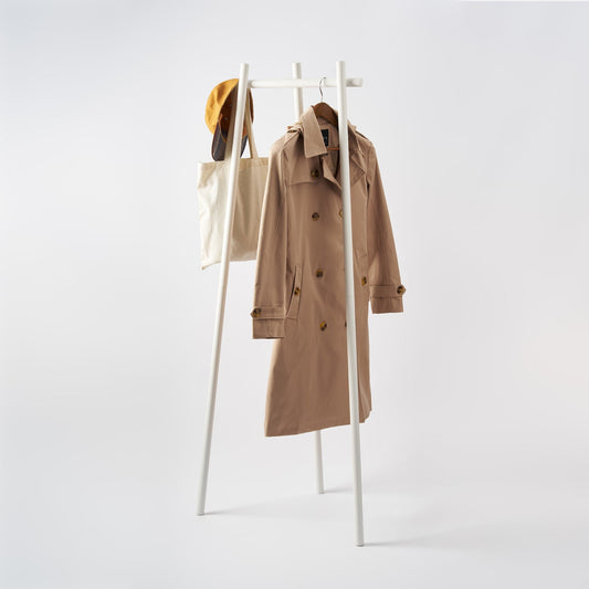 White Tower tri-post coat rack holding a separate coat, hat and tote bag