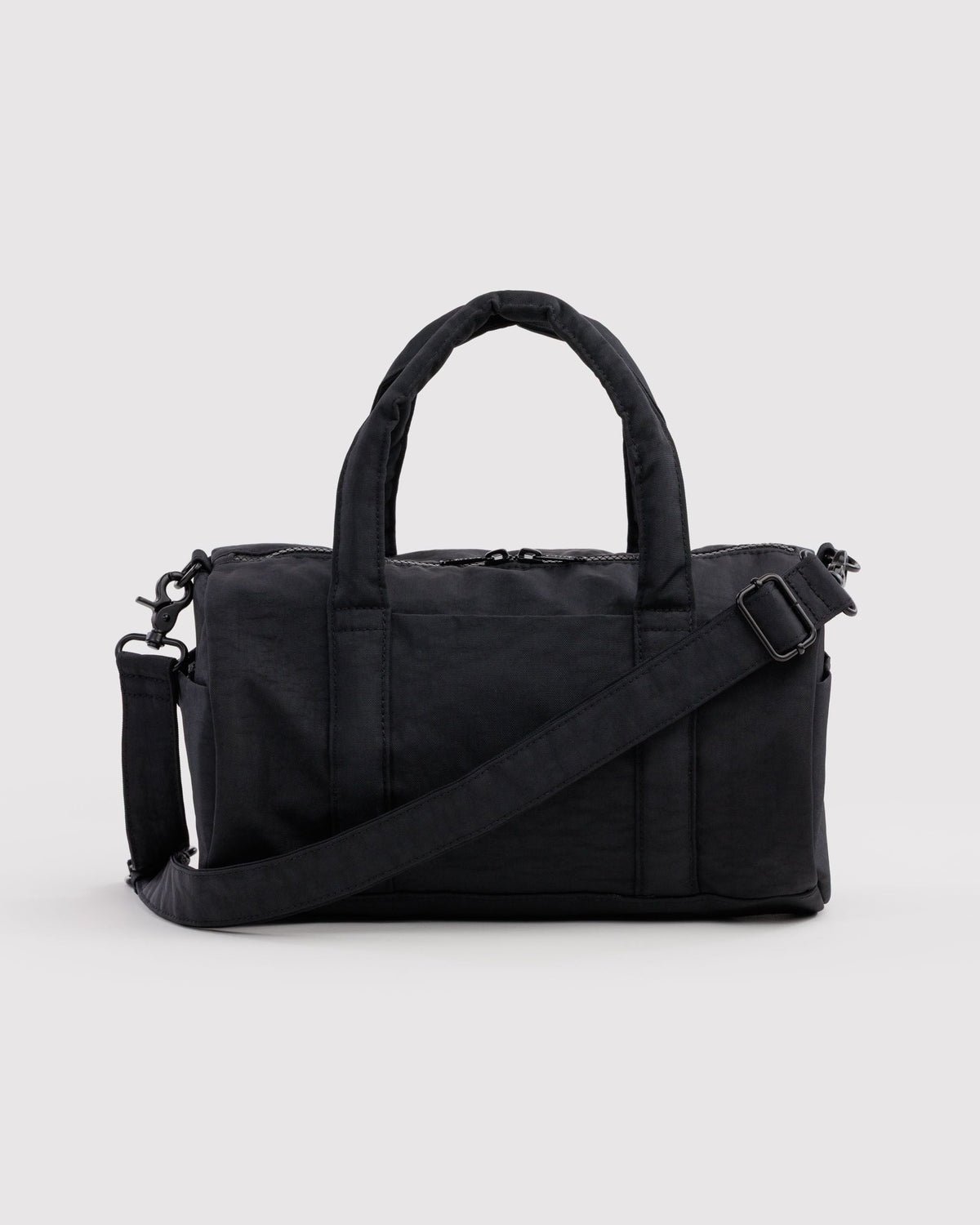 BAGGU Nylon Duffle Bag in Black, front view on a light background | Black