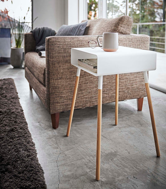 Yamazaki Home Plain Storage Table - Tall (23" H) - Steel + Wood, white tall table holding mug and books beside sofa