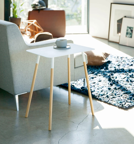 Yamazaki Home Plain Side Table (20" H) - Steel + Wood, white table with coffee cup beside sofa