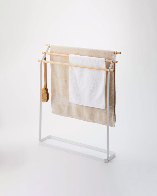 Yamazaki Home Tosca Bath Towel Rack (32" H) - Steel + Wood, white rack holding towels and a bath brush