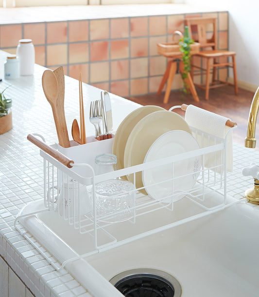 Yamazaki Home Tosca Over-the-Sink Dish Rack - Steel + Wood, white rack drying plates and utensils over a sink