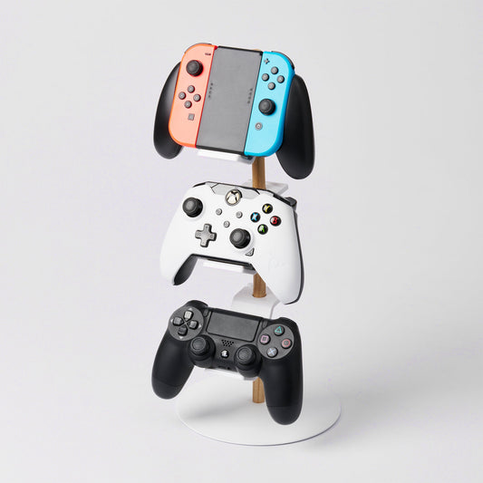 Yamazaki Home Tower Controller Stand - Steel and Wood — white stand holding three gaming devices.