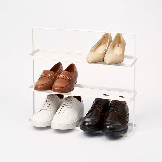 Yamazaki Home Tower Three-Tier Shoe Rack - 18-Inch Steel — white rack holding shoes on three tiers.