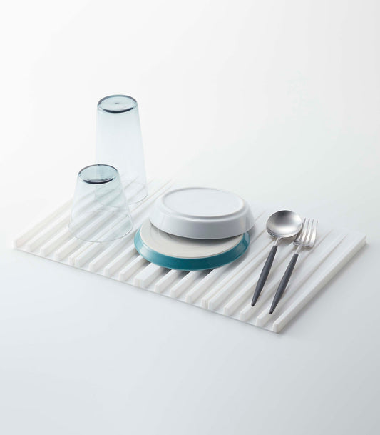 Yamazaki Home Tower Folding Dish Drainer Mat & Trivet - Silicone, white silicone mat holding dishes and utensils