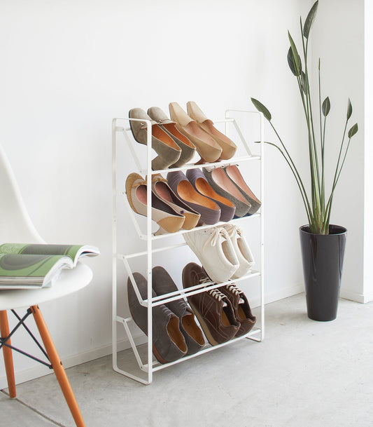 Yamazaki Home Frame Slim Shoe Rack (31" H) - Steel, white four-tier rack holding shoes in an entryway