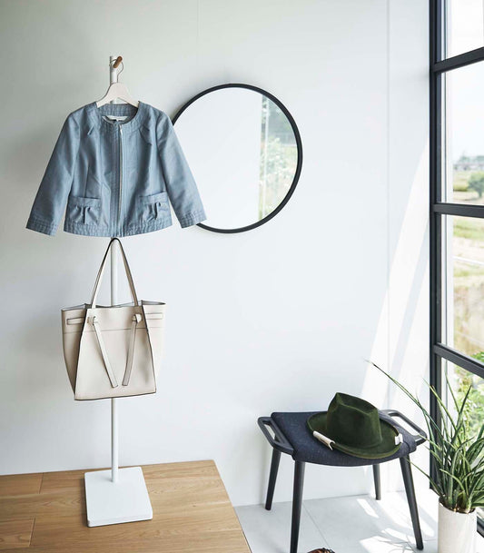 Yamazaki Home Tower Freestanding Coat Rack - Steel and Wood, white coat rack holding jacket and handbag beside mirror