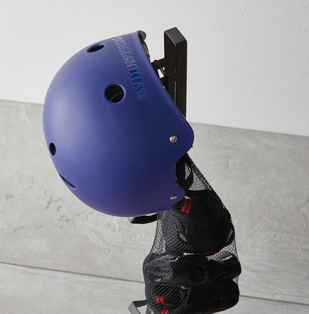 Yamazaki Home Tower Kids' Helmet Stand - Steel, close-up of blue helmet hanging on stand