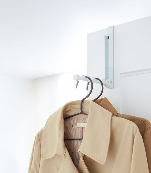 Yamazaki Home Smart Over-the-Door Hook - Steel, white 1-Hook version holding clothes over a door