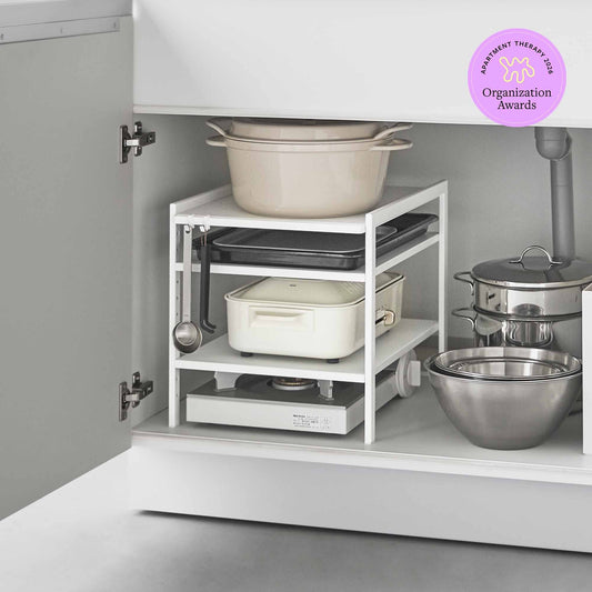 Yamazaki Home Tower Three-Tier Cabinet Storage Rack - White, white rack holding cookware in cabinet with Apartment Therapy Organization Awards badge