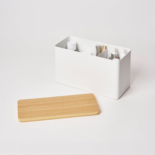Yamazaki Home Rin Countertop Organizer - Steel + Wood, open white organizer holding toiletries with wooden lid beside it