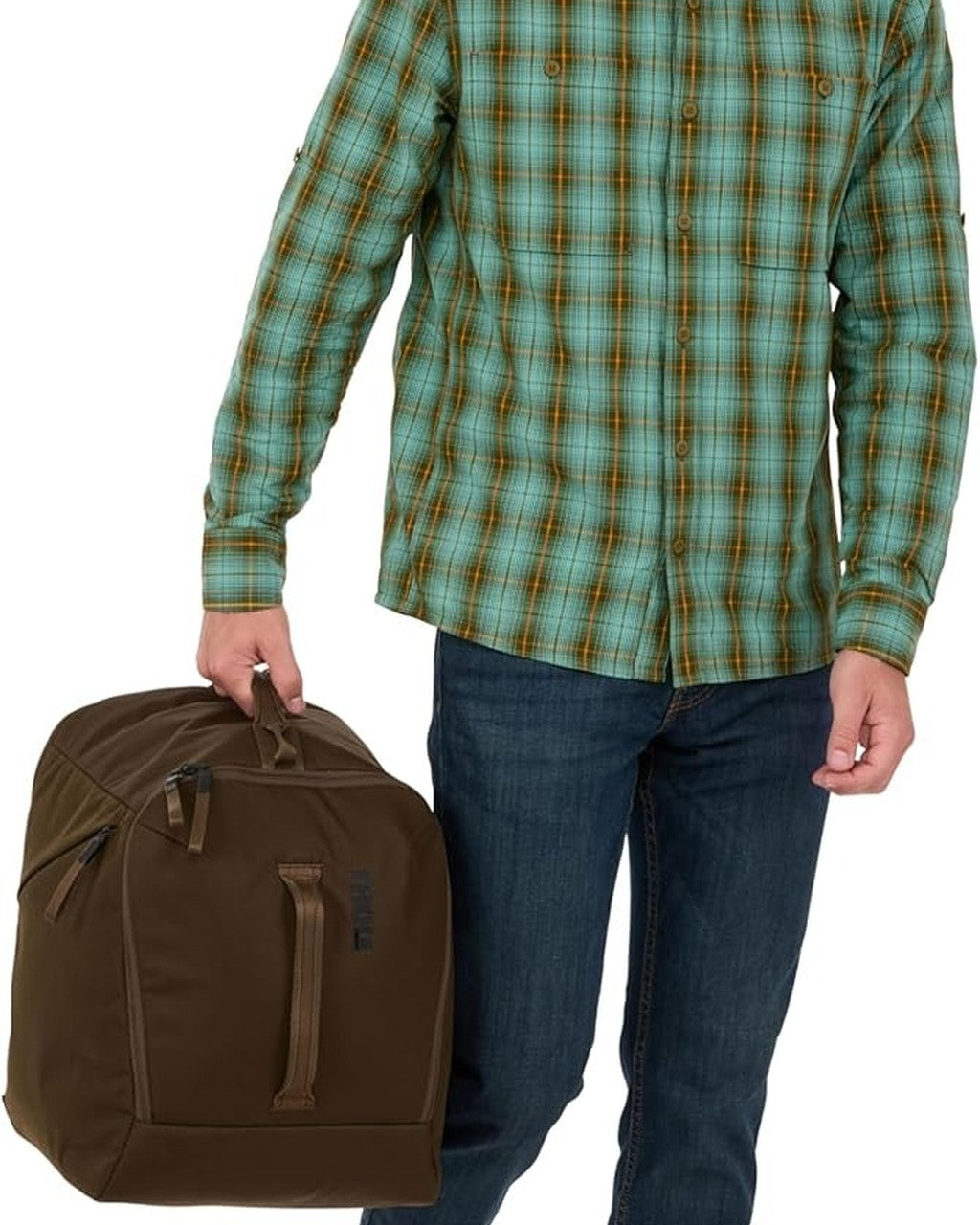 Person wearing a plaid shirt holding a brown duffel bag against a white background Thule Roundtrip Boot Bag 35L | Deep Khaki 