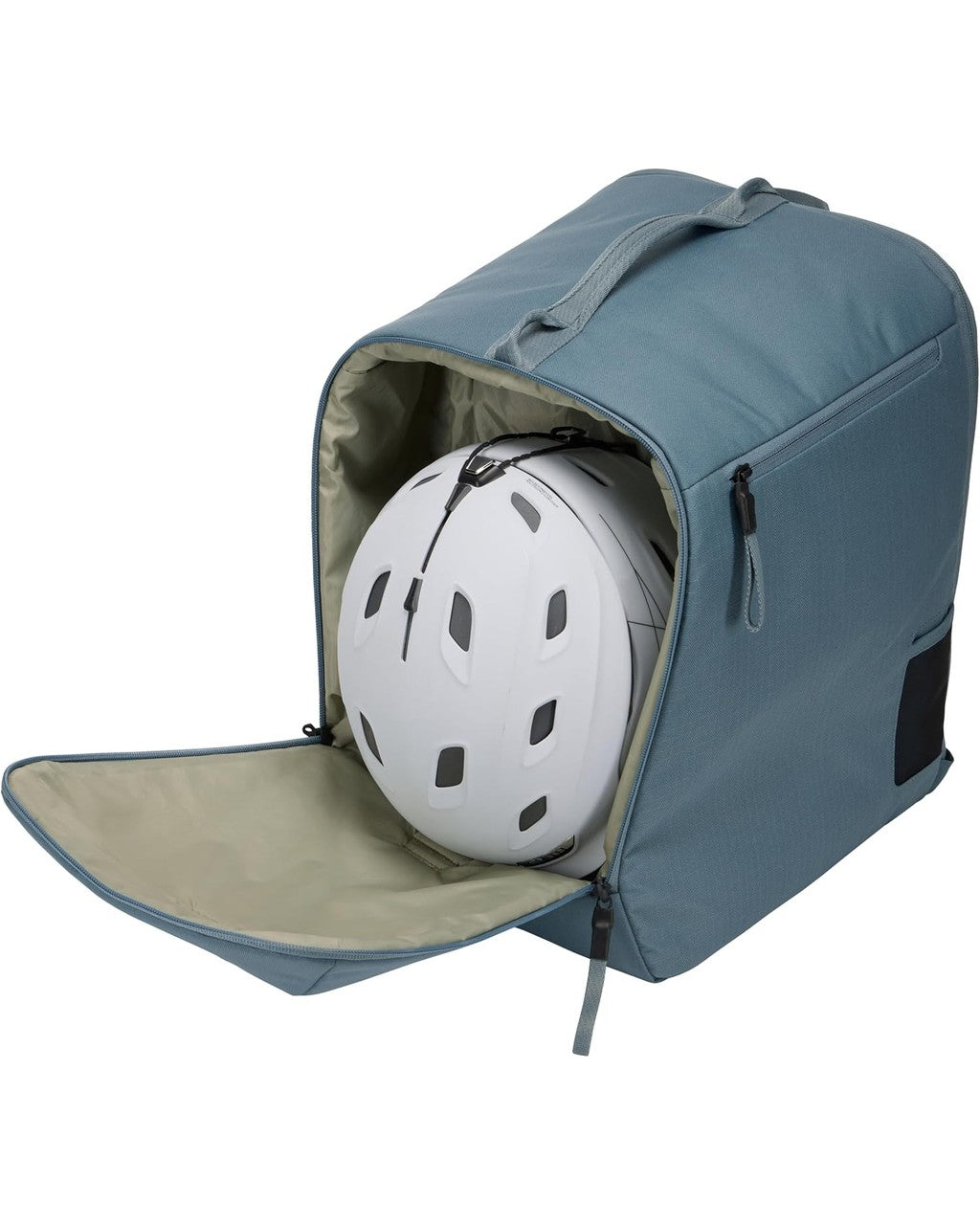 Blue backpack with a helmet inside on a white background Thule Roundtrip Boot Bag 35L | Mid Blue