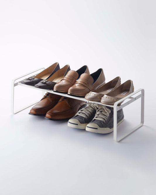 Yamazaki Home Frame Stackable Shoe Rack (7" H) - Steel, white rack holding shoes above and below the shelf