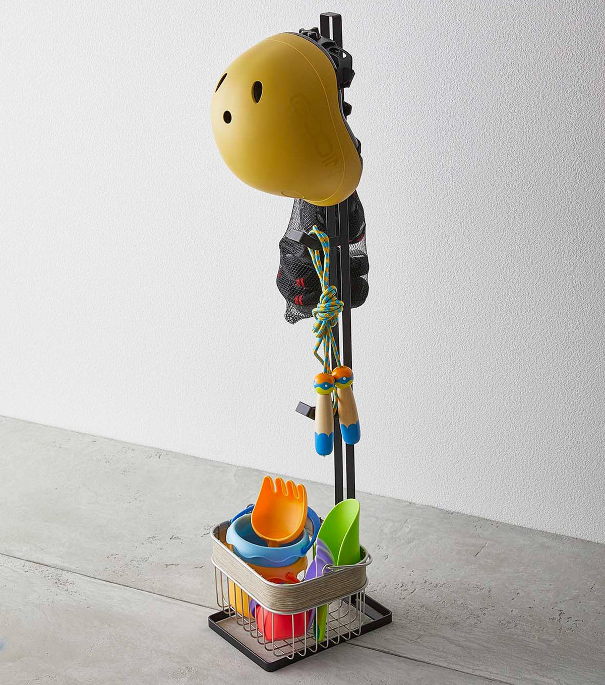Yamazaki Home Tower Kids' Helmet Stand - Steel, black stand holding helmet, sports gear and a basket
