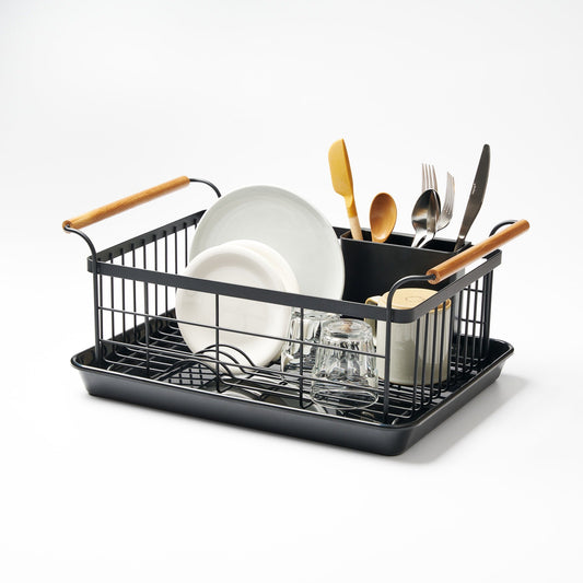 Yamazaki Tosca black dish rack with wood handles, drying tray and utensil holder, shown with separate dishes, glasses and cutlery