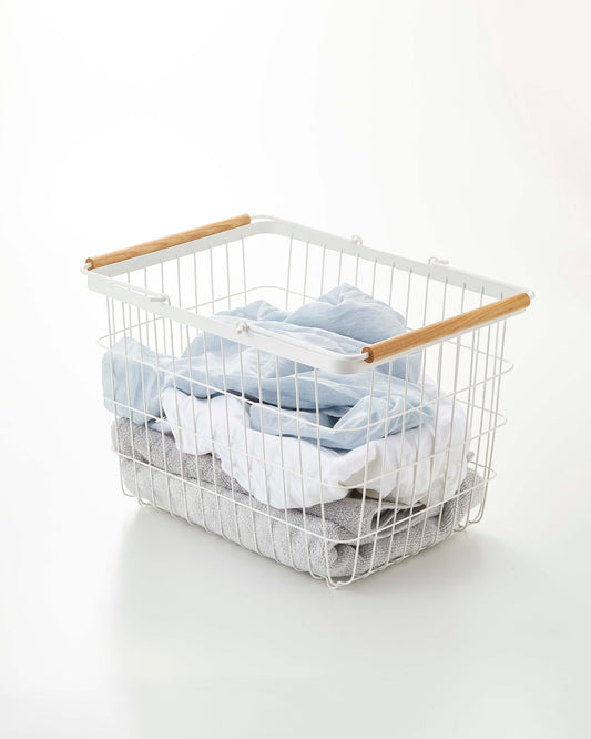 Yamazaki Home Tosca Wire Basket - Two Sizes - Steel + Wood, Medium white wire basket holding folded laundry