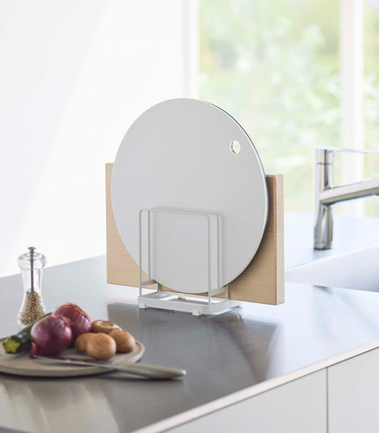 Yamazaki Home Tower Round Cutting Board Stand - Steel, white stand holding round and rectangular boards beside sink