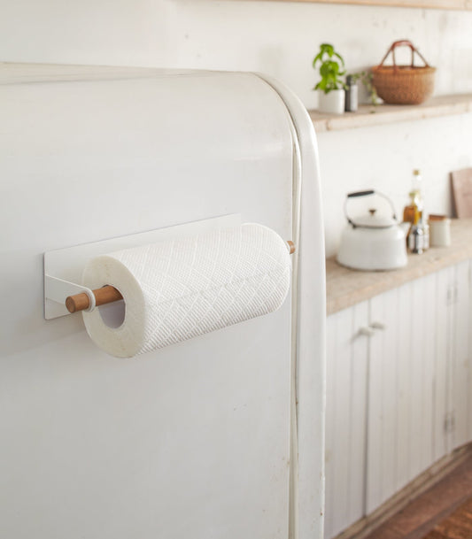 Yamazaki Home Tosca Magnetic Paper Towel Hanger - Steel + Wood, white holder on a refrigerator with paper towel roll