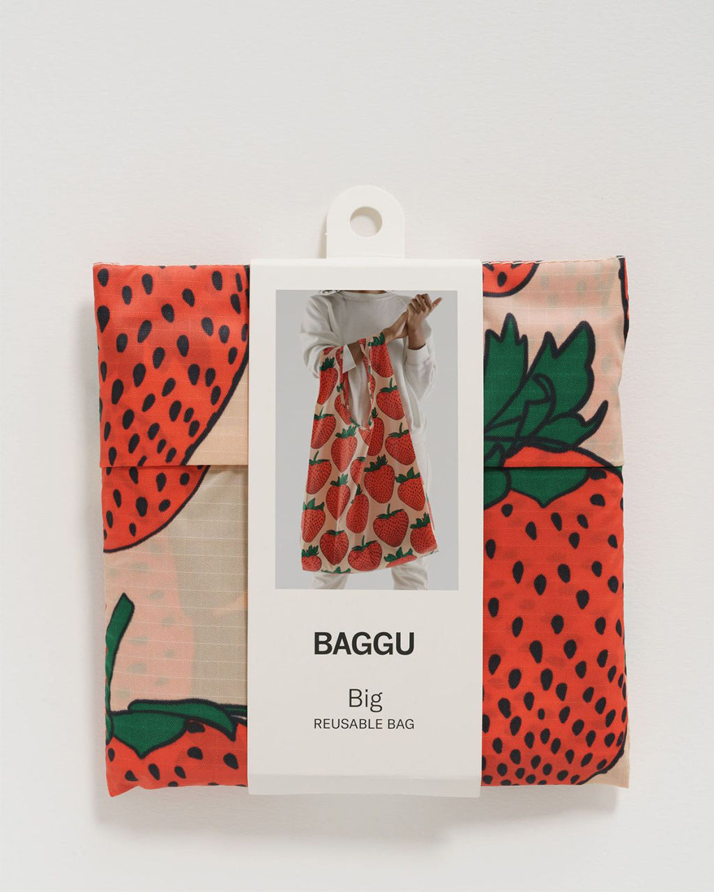 Baggu Big Reusable Bag folded into a pouch | Strawberry